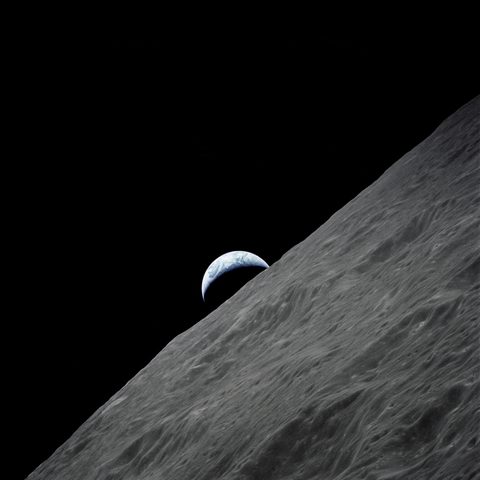Crescent Earth rises above the lunar horizon by NASA, framed print
