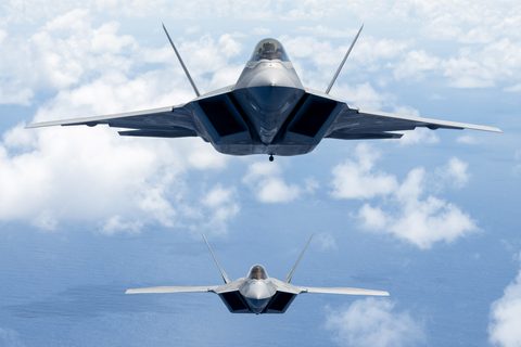 F-22 Raptors off Oahu by USAF / Emerson Nuñez, framed print