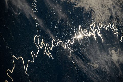 Sun glint on a South American river by NASA / Don Pettit, 2024, framed print