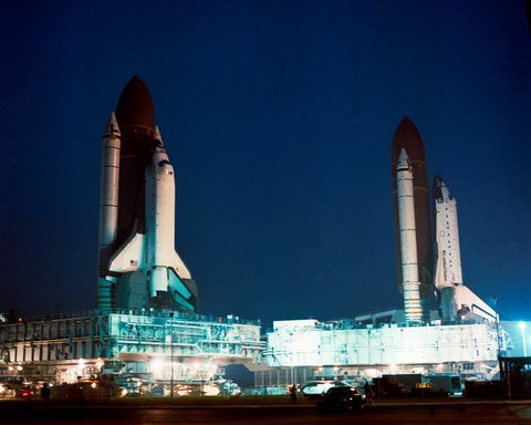 Columbia rolls past Atlantis at the VAB by NASA, 1990, framed print