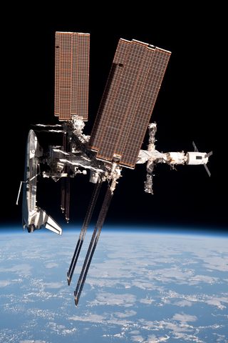 Endeavour docked over Earth by NASA / Paolo Nespoli, 2011, framed print