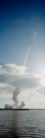 Discovery STS-31 punches through the clouds by NASA, 1990, framed print